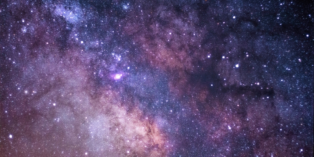 Colorful photograph of stars in the night sky.