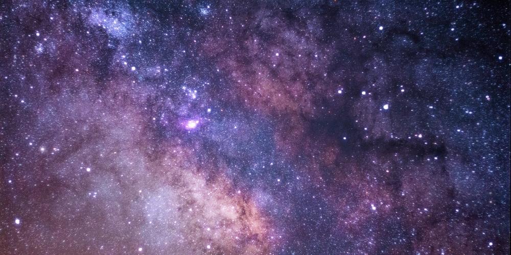 Colorful photograph of stars in the night sky.